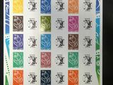 a close up of a sheet of stamps with different designs on them