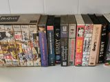 a lot of books that are stacked on top of each other