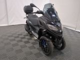 a picture of a motorcycle parked on a checkered floor