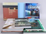 several books are stacked on top of each other on a table