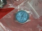 two watches sitting on top of a plastic bag