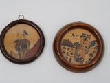 two pictures hanging on the wall of a room