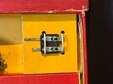 a toy truck in a box with a phone in it