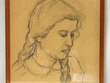 dessin représentant le visage d'une femme dans un cadre en bois