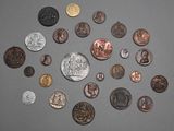 a lot of coins that are on the table
