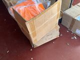 many boxes of oranges and bags of oranges on the floor