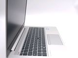 a close up of a laptop computer on a white surface