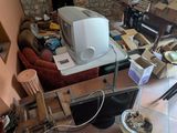 an image of a messy room with a computer on the desk