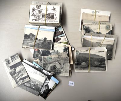 a bunch of old photos hanging on a wall