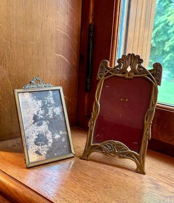 a picture of a picture frame and a picture frame on a window sill