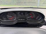 a close up of a car dashboard with a speedometer and gauges