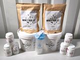 two buckets of whey yogurt next to a bucket of whey yogurt
