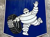 a michel michel tire sign on the side of a building