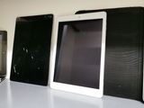 three different types of electronic devices on a table