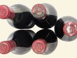 six bottles of wine sitting next to each other on a table