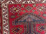 an image of a red and blue rug with a cross on it