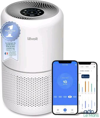 a close up of a smart air purifier next to an iphone