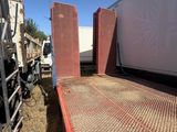 a flat bed trailer with a flat bed on the back of it