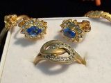 three rings and a ring with blue stones on it
