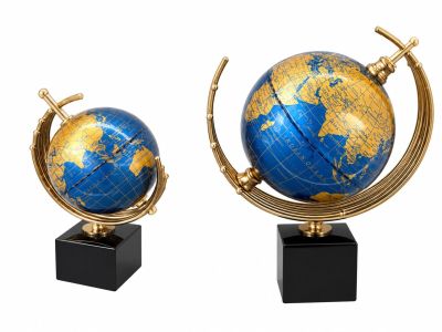 two blue and gold globes sitting on black stands