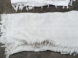 two pieces of white cloth on the floor