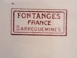 a close up of a plate with a sign on it