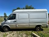 a silver van that is parked in the grass