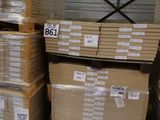 several stacks of boxes are stacked on pallets in a warehouse