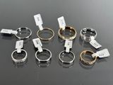 several different types of rings with tags on them on a table