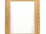 an old gold picture frame with a white background