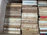 a lot of books in a box on the floor