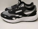 a close up of a pair of black and white sneakers