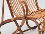 an image of a wicker rocking chair on a white background