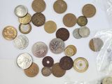 a lot of coins in a bag on the table