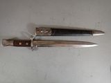 two knives that are laying next to each other on a table