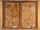 a picture of an old wooden window with peeling paint on it