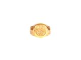 a close up of a gold ring with a smiley face on it