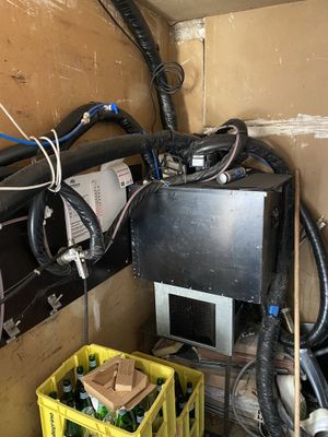 a room with a lot of wires and a lot of boxes