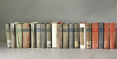 a lot of books that are lined up on a table