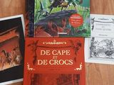 three children ' s books are sitting on a table next to each other