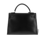 a black leather handbag on a white background