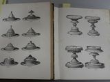 two open books with drawings of different types of cakes