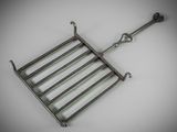 an image of a metal grill grate on a white surface