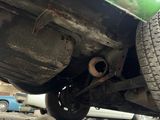 a close up view of a car ' s exhaust pipe and exhaust pipe