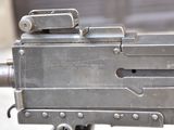 a machine gun that is sitting on top of a table