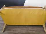 an image of a yellow couch sitting on top of a wooden floor