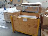 a wooden box that is sitting on a pallet in a warehouse