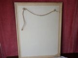 a picture of a white board with a rope on it