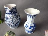 three small vases sitting next to each other on a table