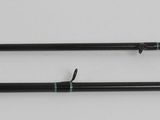 two black metal rods on a white surface with a white background